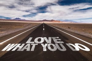 The words Love what You Do scrolled across a highway to show how to be successful