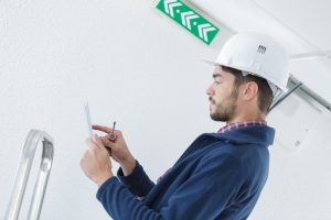 confident technician connecting with a digital tablet and using interior design apps