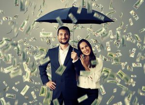 smiley successful couple with umbrella standing under money rain top show the importance of your portfolio