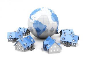 world with houses surrounding it to show think globally in real estate