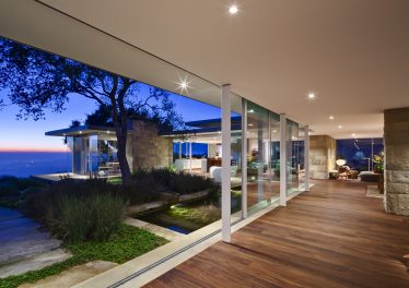 A wall of glass at a Toro Canyon estate provides panoramic views of the Pacific Ocean